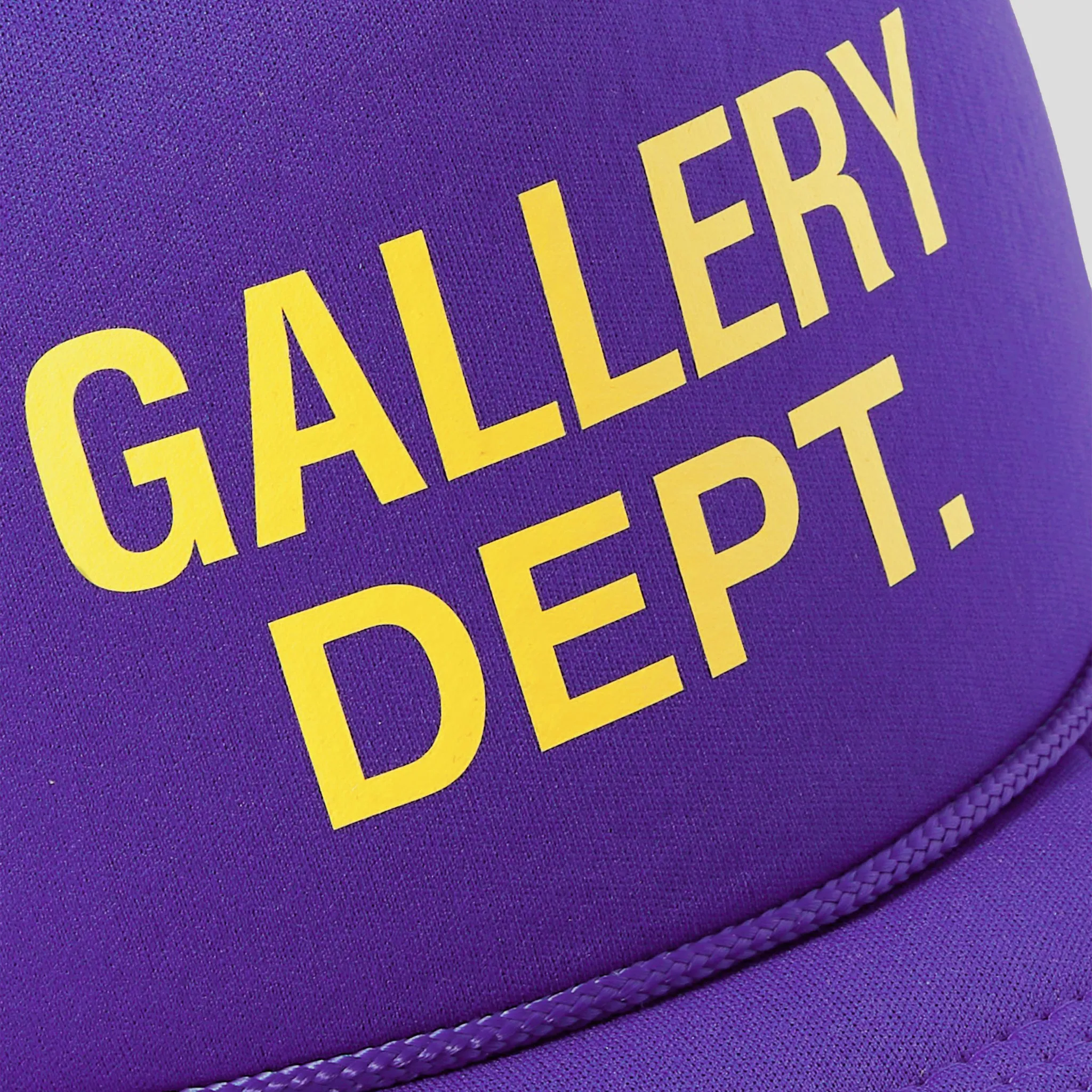 Sure! The optimized English title for this e-commerce product could be: Purple Gallery Dept. Logo Trucker Cap.